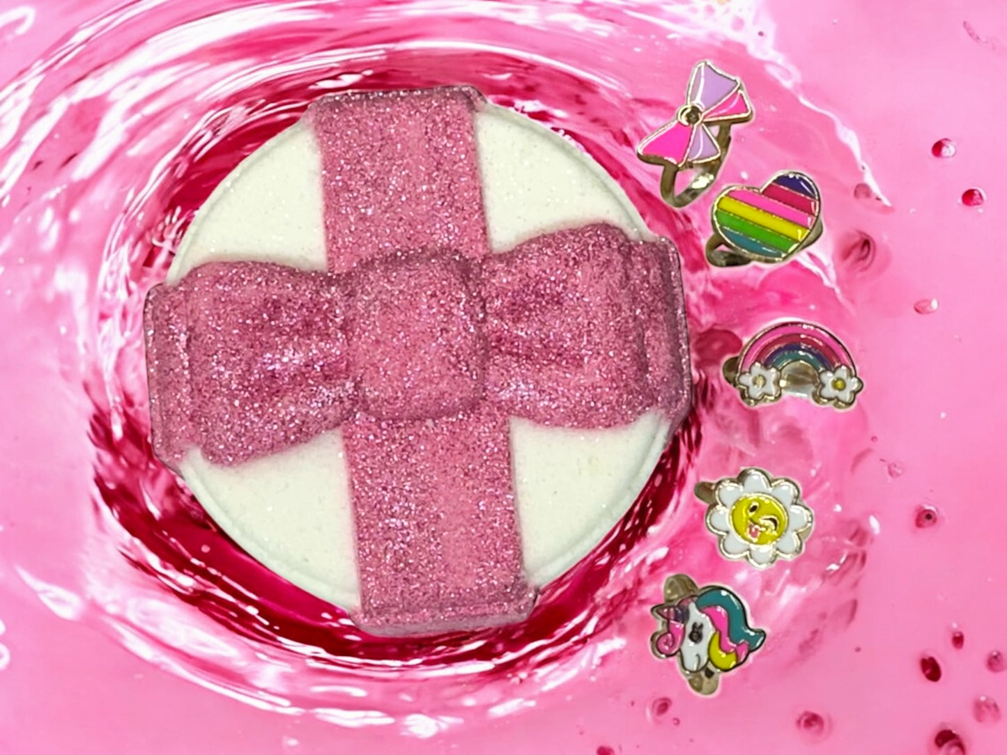 Make bath time extra magical with our Present Bath Bomb! Shaped like a sweet gift and scented in a soft, powdery newborn baby fragrance, this fizzy treat is perfect for little ones. Each bath bomb contains a hidden surprise ring inside—an assorted girls' ring revealed as the bomb fizzes! A fun, gentle, and sparkly experience for birthdays, holidays, or just-because surprises.