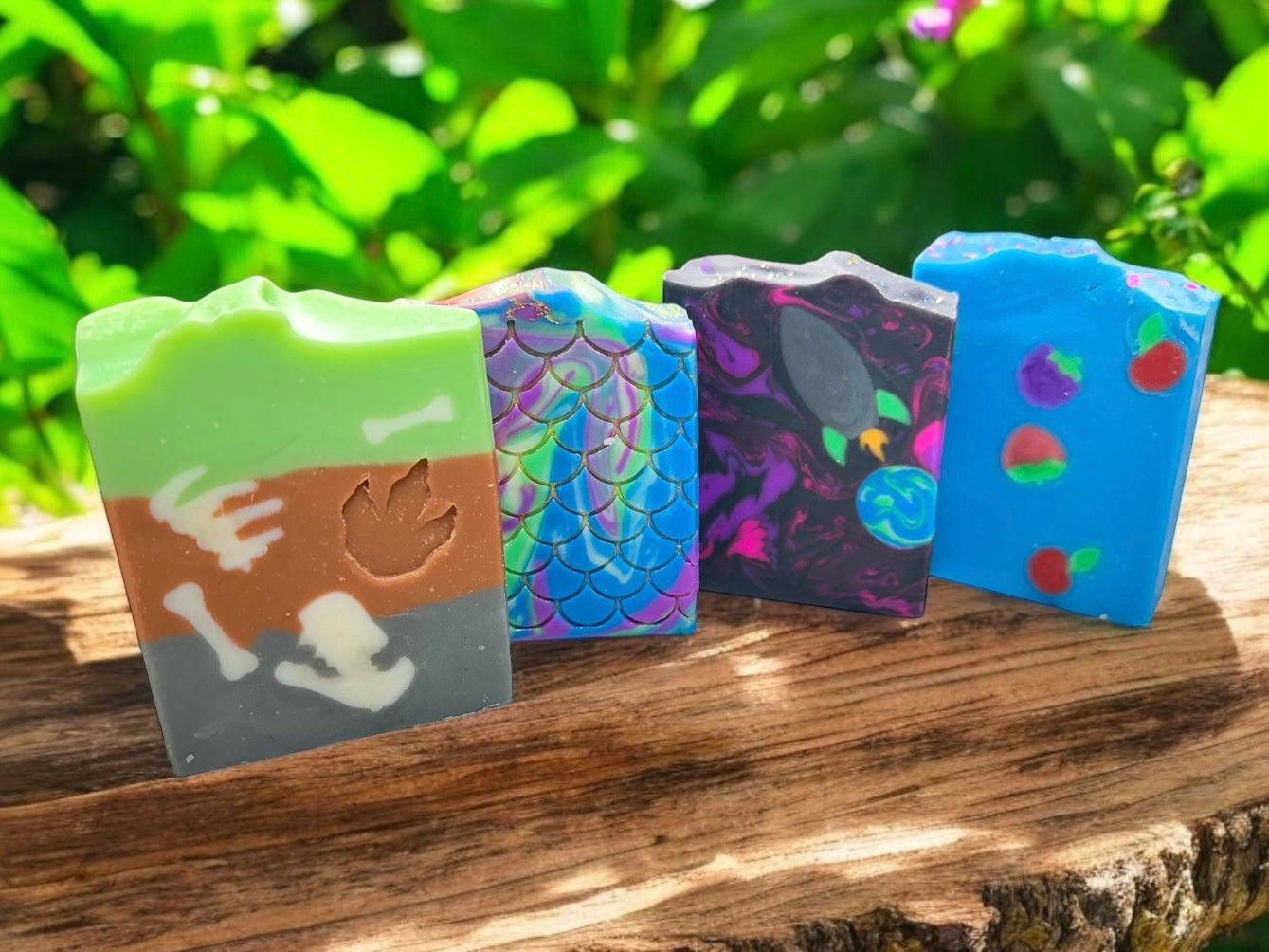 Make bath time an adventure with our Little Sudsy Staples Handcrafted Soap Collection! Featuring 4 fun and fruity selections, these handmade soaps are gentle on skin, bursting with vibrant fragrances, and crafted with skin-nourishing ingredients like colloidal oatmeal. Choose from Dirty Dino (mango & apple), Mermaid Splash (seawater & roses), Bubble Berry Blast (berry, peach & vanilla), and Galactic Explorer (orange, berries & white musk). Handmade with love, perfect for all ages!