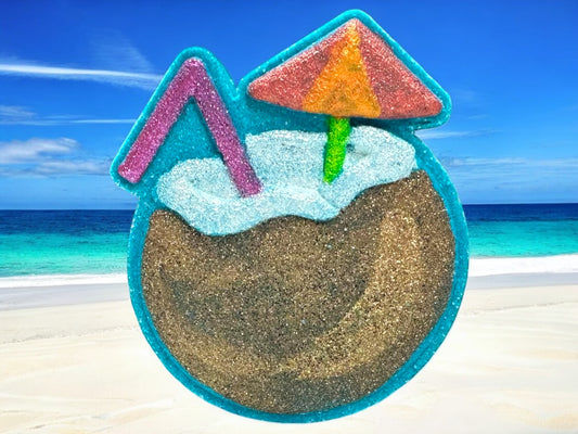 Transport your tub to the tropics with our If You Like Piña Coladas Bath Bomb!
This handmade bath bomb is shaped like a coconut drink and fizzes into a tropical blue oasis, perfect for relaxing after a long day (or pretending you’re poolside in paradise).
